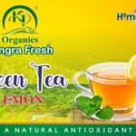 “A cup of refreshing lemon green tea with a slice of lemon and a honey dipper on the side, showcasing the vibrant yellow and green hues.”